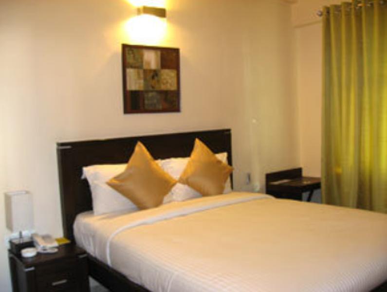 Hotel The Elite Suites Púna Pokoj fotografie